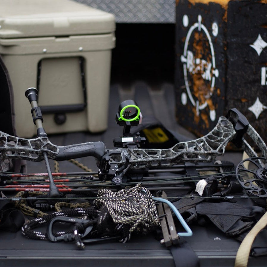 asio gear layed out on truck bed in preparation for a whitetail bow hunt. cut no corners. make sure all your gear is ready to go