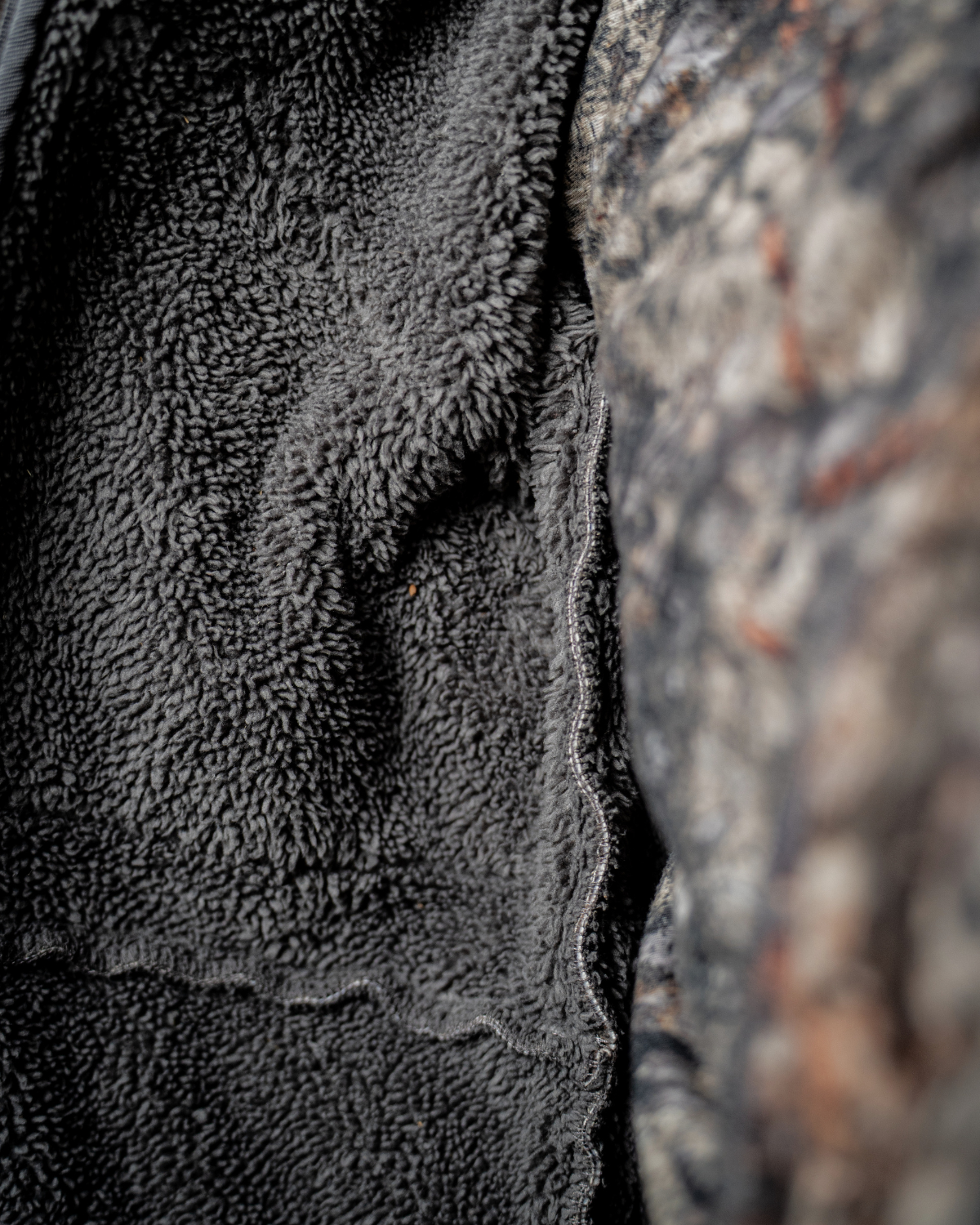 ASIO Gear heavypil sherpa fleece inside of the jacket to provide warmth while whitetail bowhunting